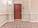 Condo entryway showcasing a stylish door with modern hardware and patterned carpeting at 3334 Peachtree Ne Rd # 614, Atlanta, GA 30326