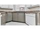 Kitchen featuring two-tone cabinets, granite countertops, and modern appliances at 3334 Peachtree Ne Rd # 614, Atlanta, GA 30326