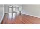 Bright living room with hardwood floors, built-in shelving, and access to a balcony at 3334 Peachtree Ne Rd # 614, Atlanta, GA 30326