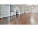 A light and airy living room featuring gleaming wood floors and built-in shelving with a desk at 3334 Peachtree Ne Rd # 614, Atlanta, GA 30326
