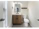 Cozy half bathroom with modern vanity and toilet and with neutral decor at 5147 Manerdale Se Dr # 5, Vinings, GA 30339