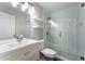 Modern bathroom with glass shower, white subway tiles, and a sleek white vanity at 5147 Manerdale Se Dr # 5, Vinings, GA 30339