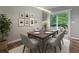 Stylish dining area with a modern light fixture and access to a wooden deck at 5147 Manerdale Se Dr # 5, Vinings, GA 30339