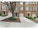 Charming townhome with brick facade, private garages, and welcoming curb appeal at 5147 Manerdale Se Dr # 5, Vinings, GA 30339