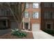 Charming townhome with brick facade, private garages, and welcoming curb appeal at 5147 Manerdale Se Dr # 5, Vinings, GA 30339