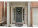 Inviting front entrance with columns, sidelights, wreath, and clear numbering at 5147 Manerdale Se Dr # 5, Vinings, GA 30339