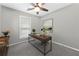 A well-lit home office with a modern desk, a comfortable chair, and natural light at 5147 Manerdale Se Dr # 5, Vinings, GA 30339