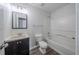 Well-lit bathroom with tub/shower combo, single sink, and modern toilet perfect for daily comfort at 621 Lakewater View Dr, Stone Mountain, GA 30087