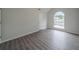 Bright bedroom with a large arched window that allows ample natural light into the room at 621 Lakewater View Dr, Stone Mountain, GA 30087