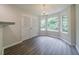 Bright dining area with new floors, updated light fixture, and abundant light at 621 Lakewater View Dr, Stone Mountain, GA 30087