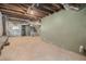 Unfinished basement with open ceilings, concrete floor, and some utility hookups at 821 Erin Sw Ave, Atlanta, GA 30310