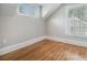 Sunlit bedroom featuring hardwood floors, base trim, and neutral paint at 821 Erin Sw Ave, Atlanta, GA 30310
