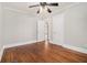 Bedroom with wood floor, gray walls, white trim, ceiling fan, and natural light at 821 Erin Sw Ave, Atlanta, GA 30310