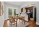 Cozy dining area next to the kitchen and featuring French doors to the backyard at 821 Erin Sw Ave, Atlanta, GA 30310