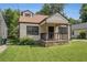 Charming bungalow with a cozy front porch, stone accents, and a well-manicured lawn at 821 Erin Sw Ave, Atlanta, GA 30310