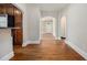 View of the hallway with hardwood floors, arched doorways, and white trim at 821 Erin Sw Ave, Atlanta, GA 30310