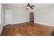 Spacious living room featuring hardwood floors and an arched doorway at 821 Erin Sw Ave, Atlanta, GA 30310