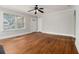 Bright, open living room featuring hardwood floors, and large window overlooking the yard at 821 Erin Sw Ave, Atlanta, GA 30310