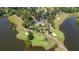Aerial view showcasing the golf course, lakes, and beautiful home at 1012 Chestnut Creek Dr, Villa Rica, GA 30180