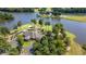 Overhead view of golf course clubhouse with landscaping near lake at 1012 Chestnut Creek Dr, Villa Rica, GA 30180