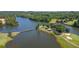 Scenic aerial view of a lake and lush golf course with bridge at 1012 Chestnut Creek Dr, Villa Rica, GA 30180