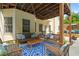 Backyard patio with furniture, potted plants and lovely wood covered pergola at 1012 Chestnut Creek Dr, Villa Rica, GA 30180