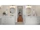 Bright bathroom featuring dual sinks, granite countertops, and modern lighting fixtures at 1012 Chestnut Creek Dr, Villa Rica, GA 30180