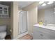 Bathroom features stand up shower, sleek vanity, updated mirror and light fixture at 1012 Chestnut Creek Dr, Villa Rica, GA 30180