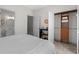Bedroom featuring a connecting bathroom and a closet space with an open bi-fold door at 1012 Chestnut Creek Dr, Villa Rica, GA 30180
