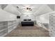 Spacious bedroom featuring carpet, neutral walls, and built-in shelves for plenty of storage at 1012 Chestnut Creek Dr, Villa Rica, GA 30180