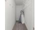 Narrow walk-in closet featuring clothing racks and carpet flooring at 1012 Chestnut Creek Dr, Villa Rica, GA 30180