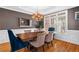Dining room with chandelier, natural light, and wood table at 1012 Chestnut Creek Dr, Villa Rica, GA 30180