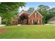 Charming brick two-story home with manicured lawn and landscape at 1012 Chestnut Creek Dr, Villa Rica, GA 30180