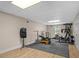Finished basement with workout equipment and rubber flooring at 1012 Chestnut Creek Dr, Villa Rica, GA 30180