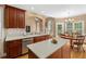 Eat-in kitchen boasts an island, lots of counter space, and stainless steel dishwasher at 1012 Chestnut Creek Dr, Villa Rica, GA 30180
