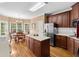 Kitchen with stainless steel appliances, island, eat-in area, and tile backsplash at 1012 Chestnut Creek Dr, Villa Rica, GA 30180