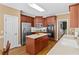 Well-equipped kitchen features stainless steel appliances, an island, and ample cabinet space at 1012 Chestnut Creek Dr, Villa Rica, GA 30180