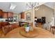 Kitchen and breakfast nook include cherry cabinets and table set at 1012 Chestnut Creek Dr, Villa Rica, GA 30180
