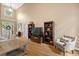 Bright living room boasts high ceilings, hardwood floors, and a large window for natural light at 1012 Chestnut Creek Dr, Villa Rica, GA 30180