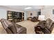 Finished basement with couches, shelving, a tv, and carpet flooring at 1012 Chestnut Creek Dr, Villa Rica, GA 30180