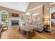Spacious living room with hardwood floors, fireplace, and ample natural light at 1012 Chestnut Creek Dr, Villa Rica, GA 30180
