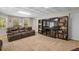 Finished basement with couches, shelving, a tv, and carpet flooring at 1012 Chestnut Creek Dr, Villa Rica, GA 30180