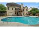 Spacious backyard featuring a large in-ground pool, deck, and ample seating for outdoor entertaining at 1012 Chestnut Creek Dr, Villa Rica, GA 30180