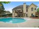 Beautiful backyard with a refreshing pool, deck, and seating, perfect for outdoor enjoyment and relaxation at 1012 Chestnut Creek Dr, Villa Rica, GA 30180
