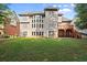 Large backyard with multilevel deck and patio, and a beautiful rear home elevation at 10565 Highgate Manor Ct, Duluth, GA 30097