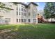 Spacious backyard with mature trees and multilevel deck and patio at 10565 Highgate Manor Ct, Duluth, GA 30097
