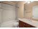 Bright bathroom featuring a tub, shower, white tile, and single sink vanity at 10565 Highgate Manor Ct, Duluth, GA 30097