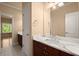 Bathroom featuring marble countertop, wood cabinets, and tile flooring at 10565 Highgate Manor Ct, Duluth, GA 30097