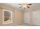 Bedroom with double closets, a window, neutral walls and carpeting at 10565 Highgate Manor Ct, Duluth, GA 30097