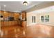 Open kitchen featuring wood cabinets, stainless appliances, and granite countertops at 10565 Highgate Manor Ct, Duluth, GA 30097